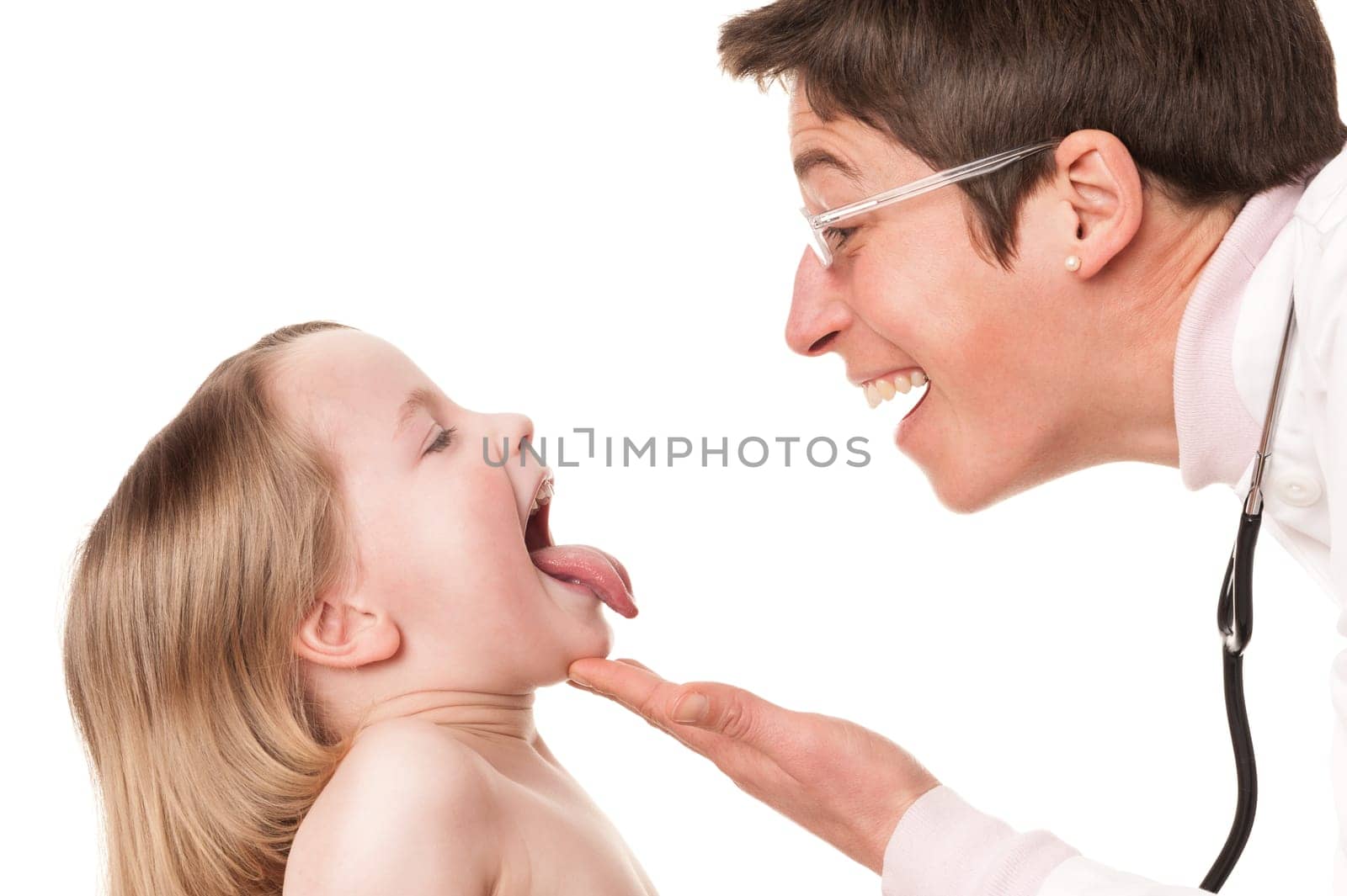 Toddler at pediatrician in front of white background