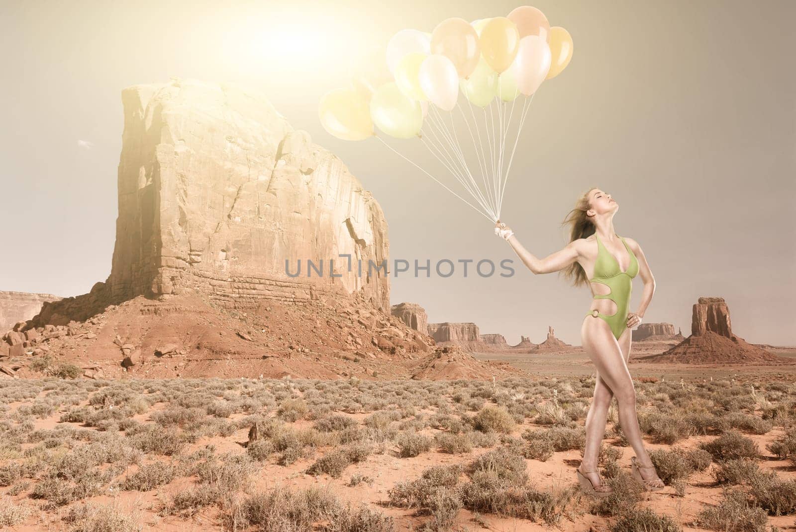 Young woman with a bikini in the desert