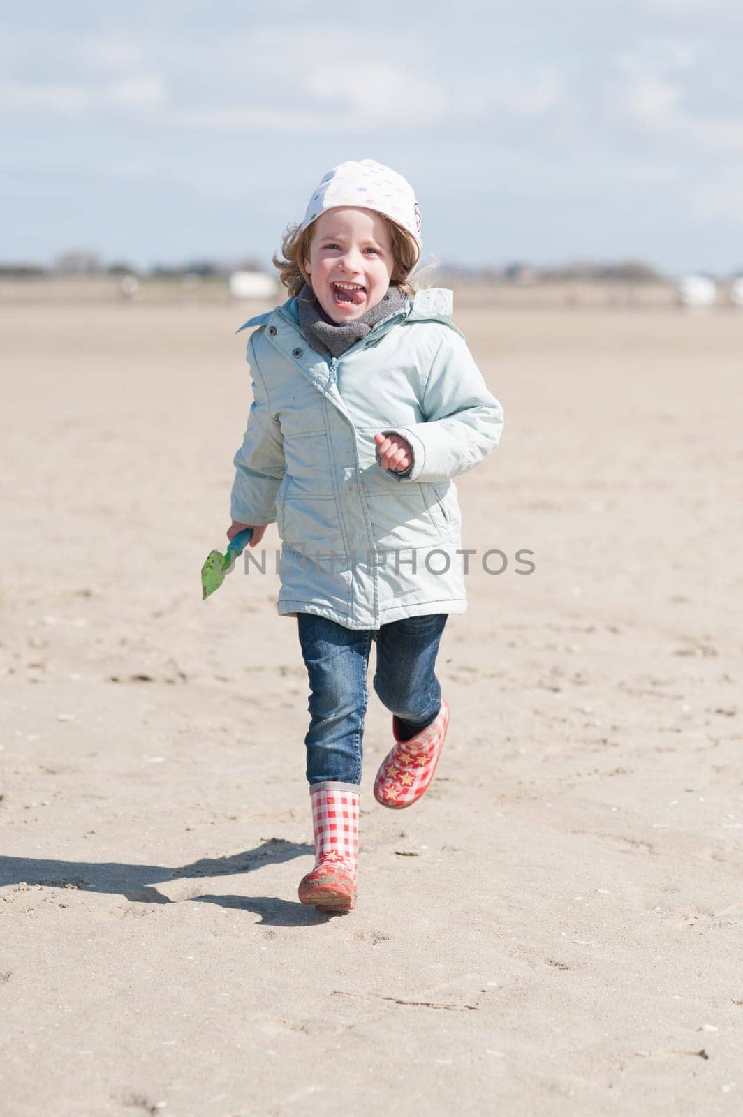 Toddler running on the beach