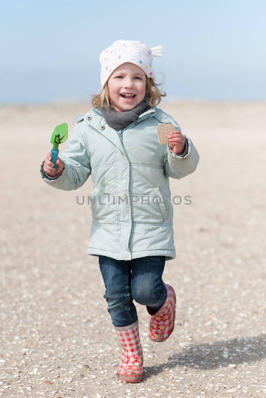 Toddler running on the beach