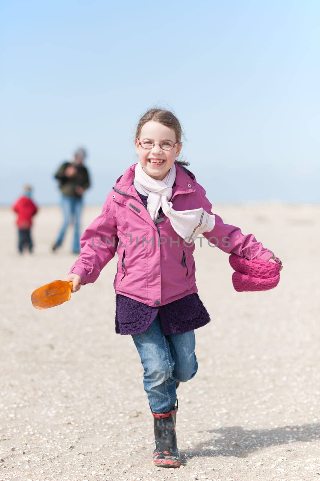 Toddler running on the beach