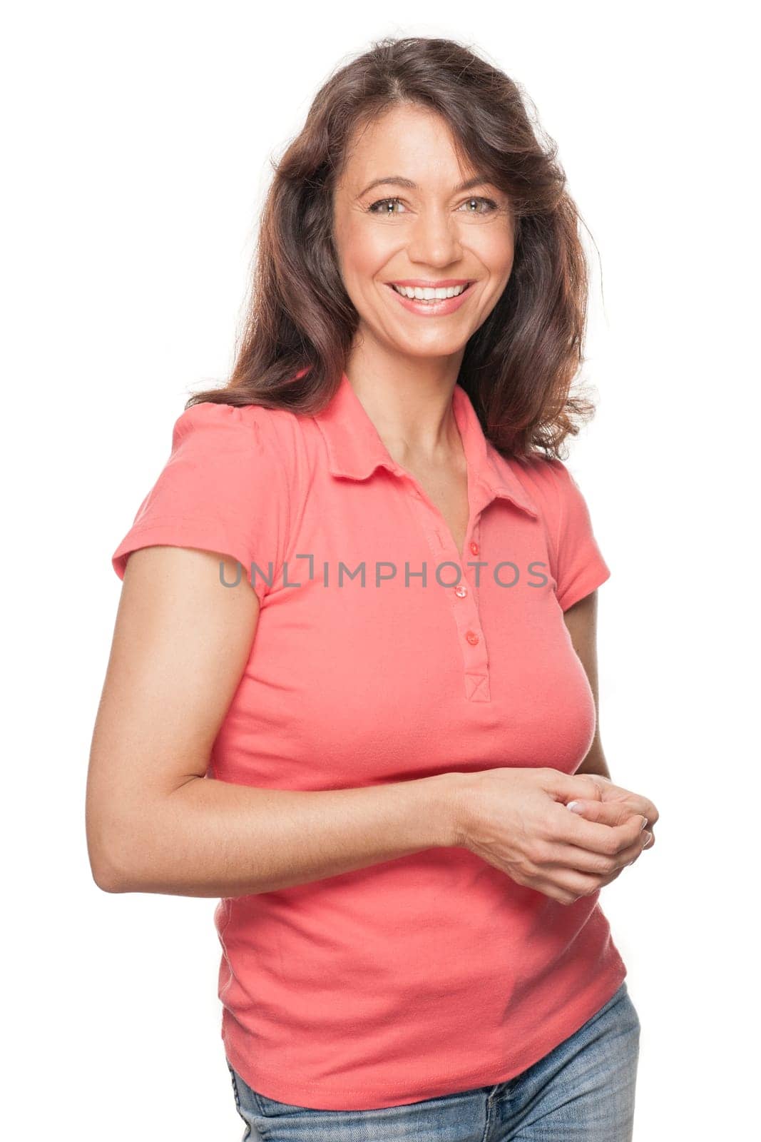 Young and smiling woman in front of white background