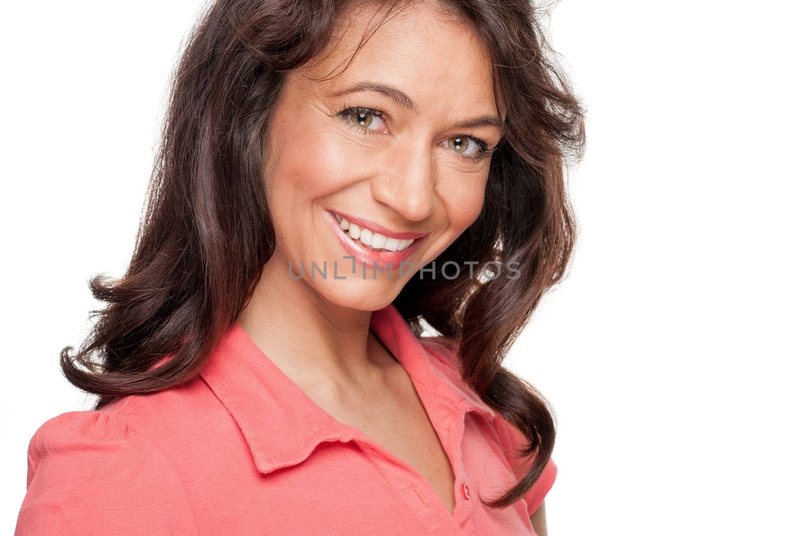 Young and smiling woman in front of white background