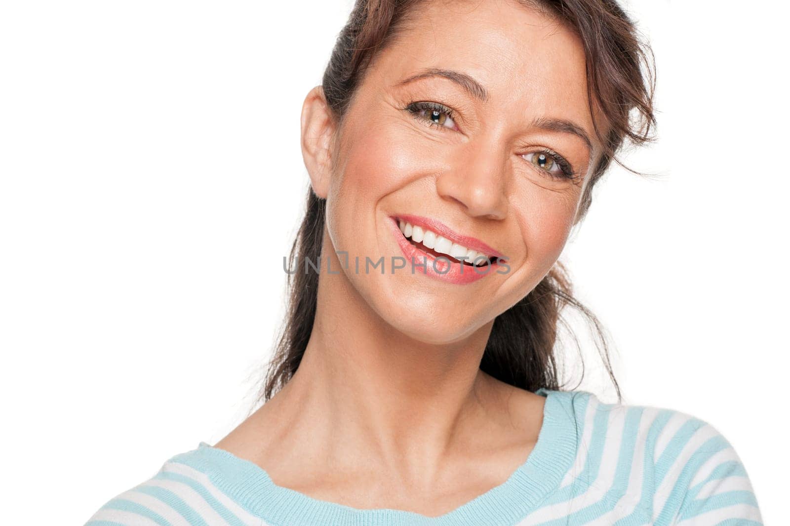 Young and smiling woman in front of white background