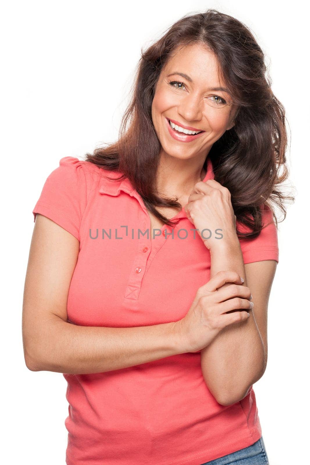 Young and smiling woman in front of white background