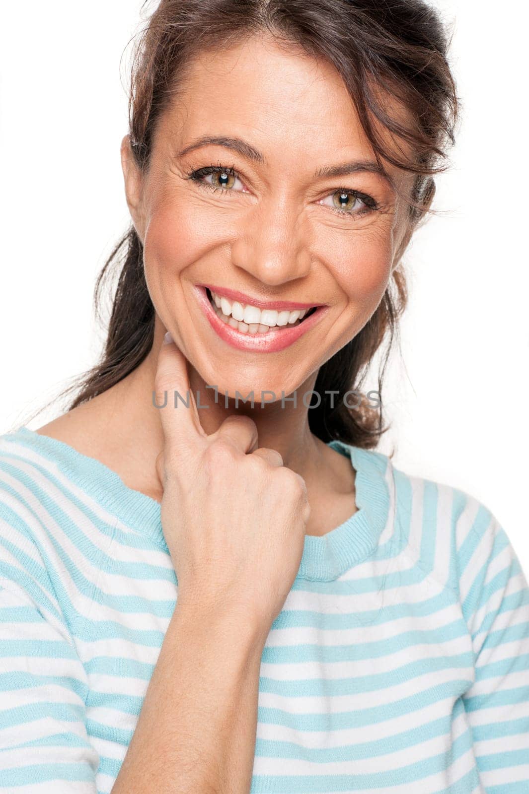 Young and smiling woman in front of white background