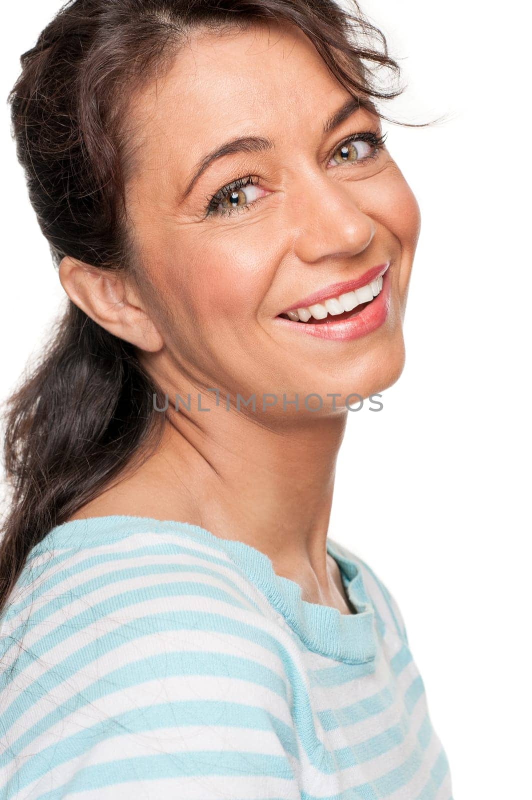 Young and smiling woman in front of white background