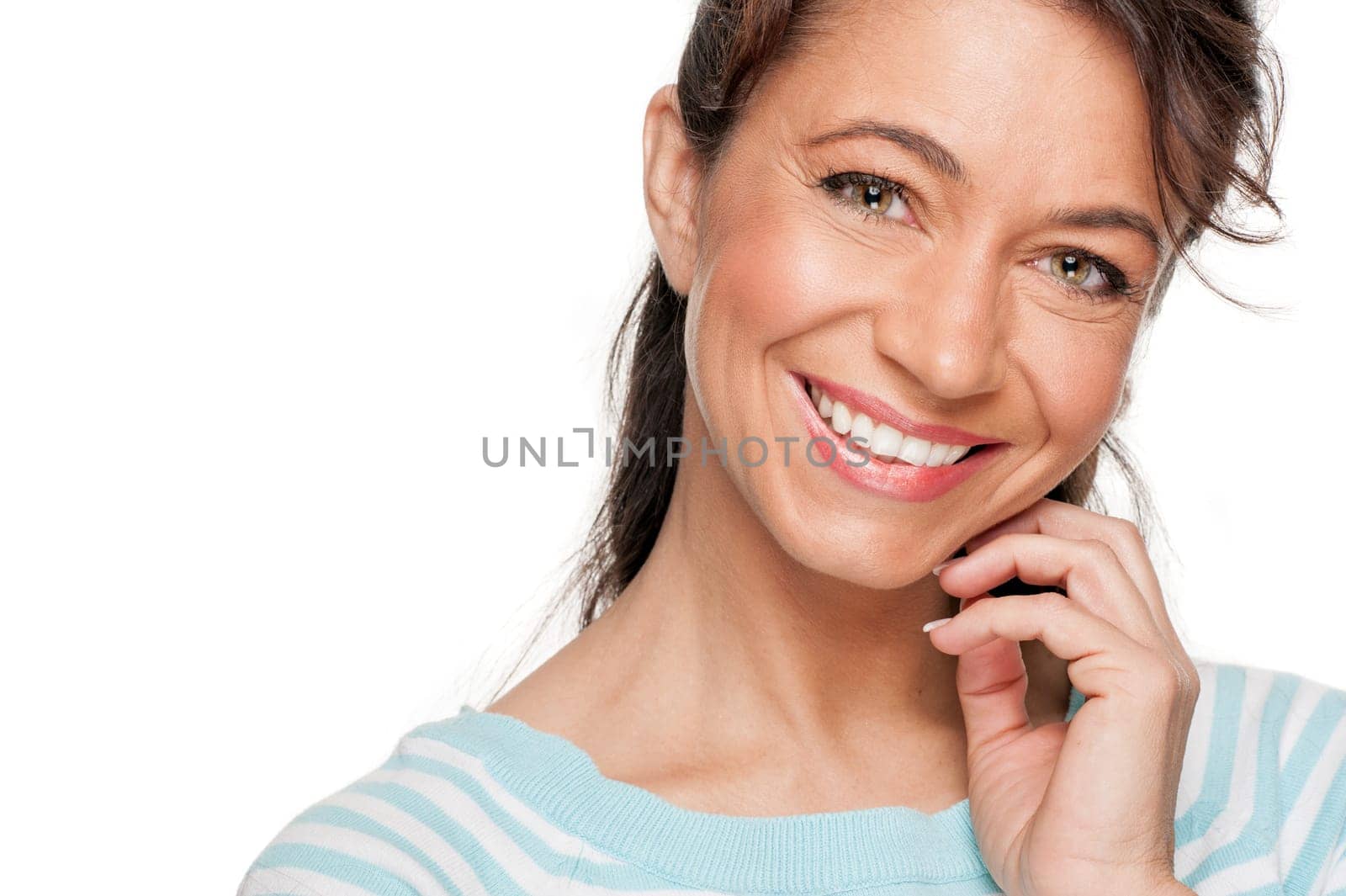 Young and smiling woman in front of white background