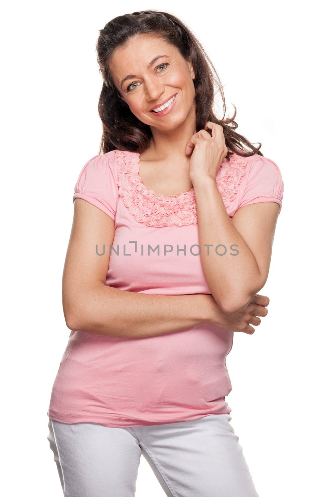 Young and smiling woman in front of white background