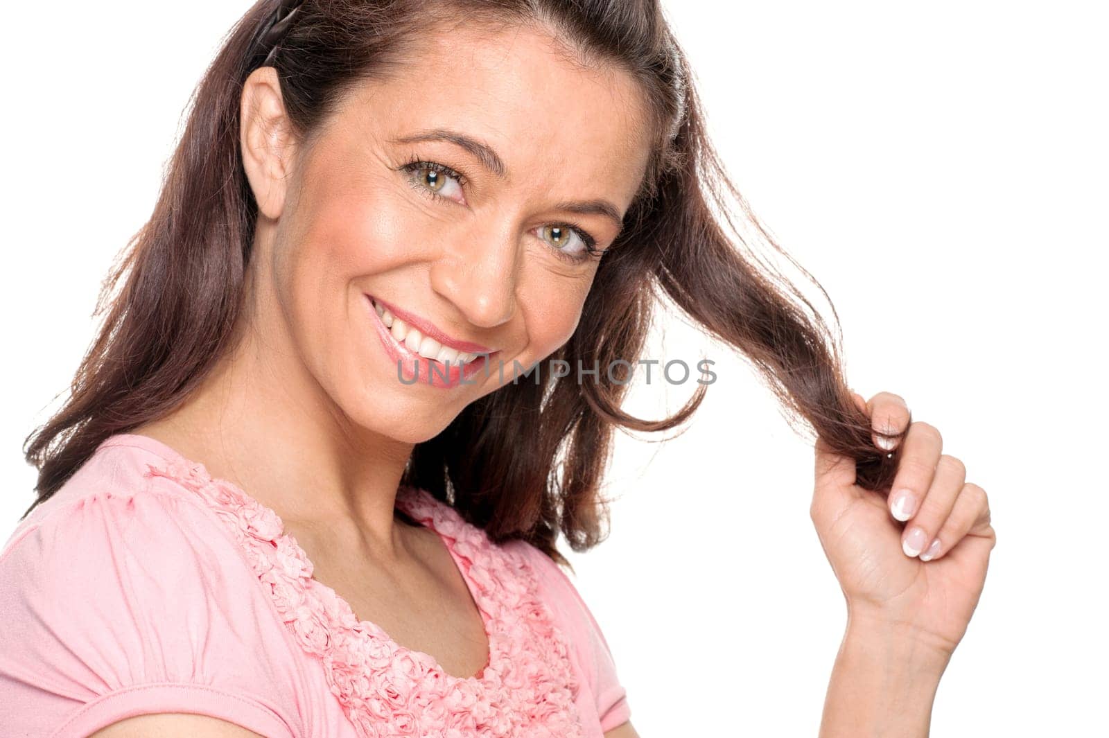 Young and smiling woman in front of white background