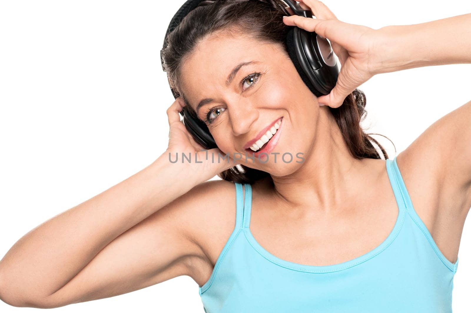 Smiling woman with a headphone against a white background