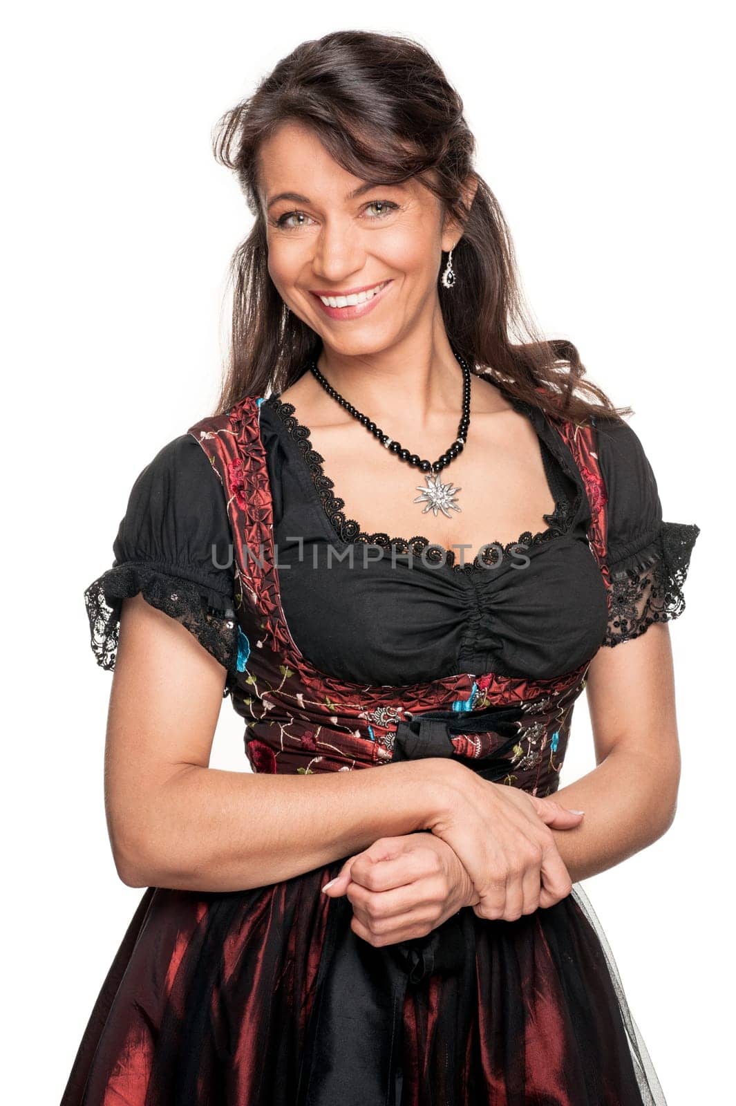Happy woman with a traditional costume against a white background