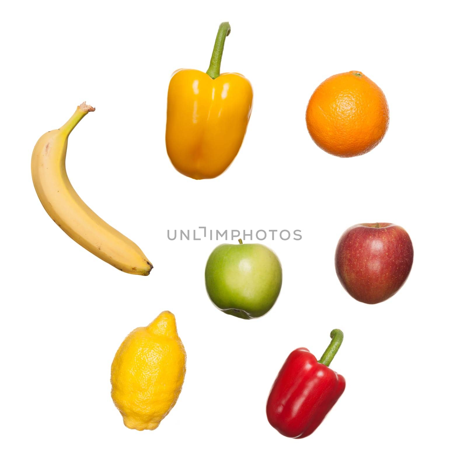 Fresh fruits and vegetables against white background