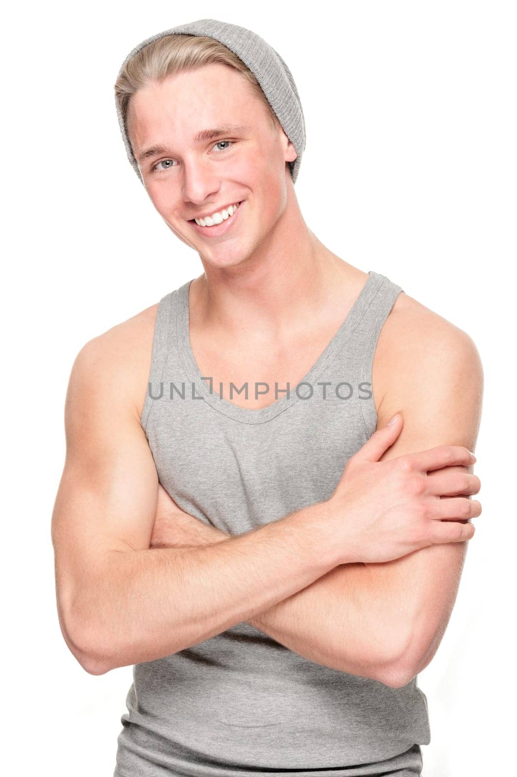 Smiling young man in front of white background