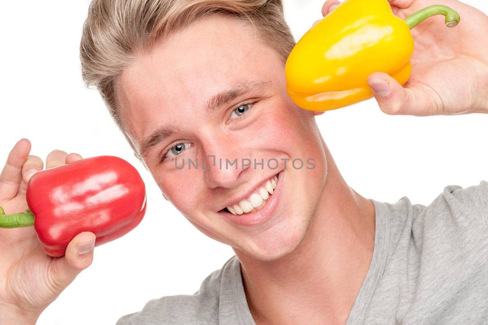 Young and smiling man with pepper
