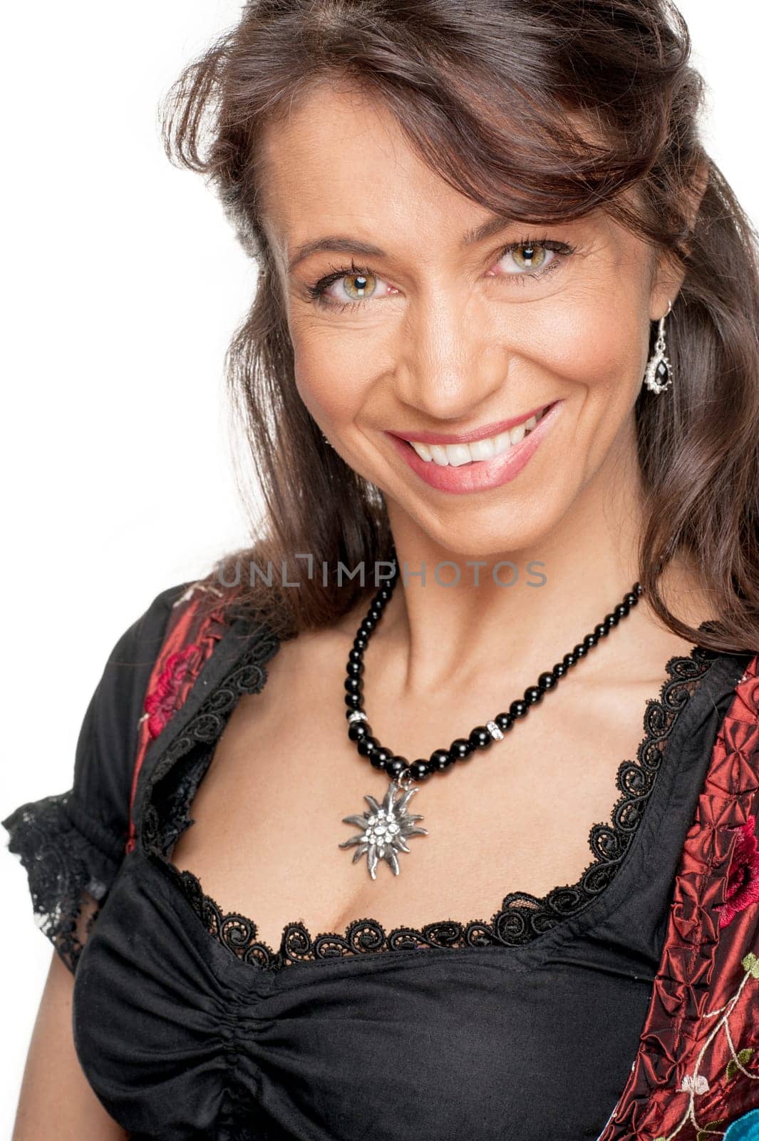 Happy woman with a traditional costume against a white background