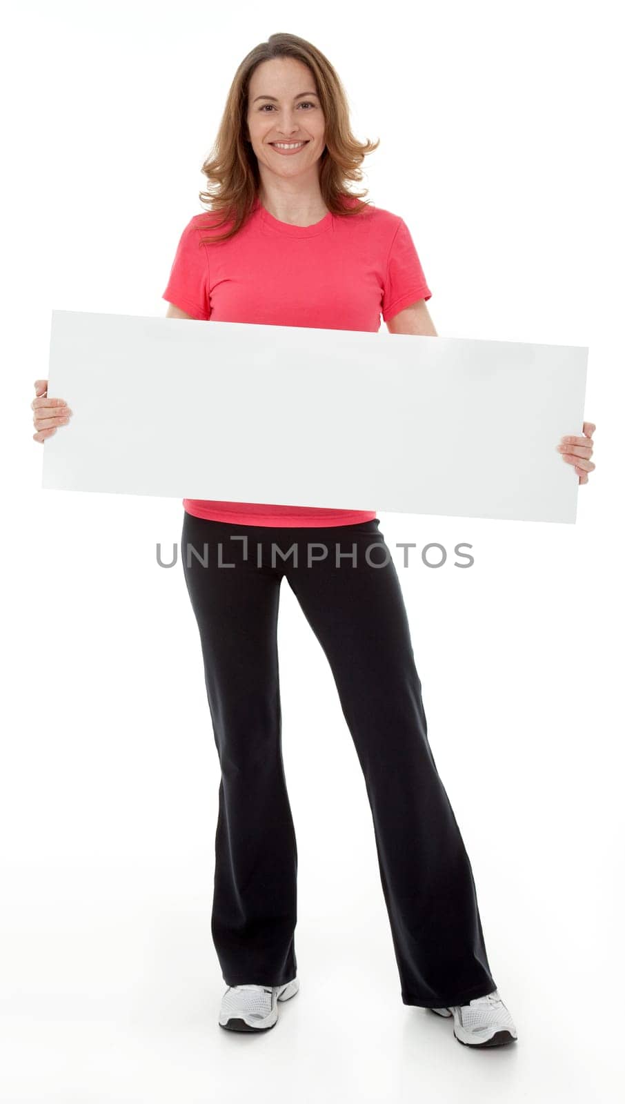 Attractive adult woman standing, holding blank sign, isolated on white.