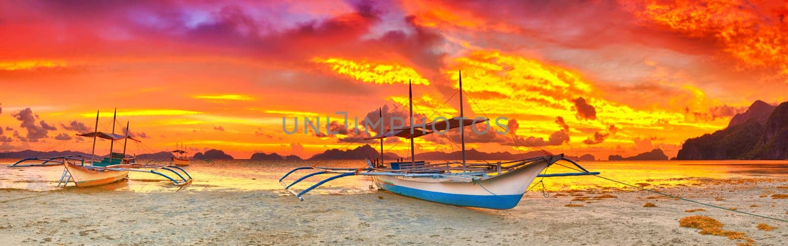 Traditional philippine boat bangka at sunset time