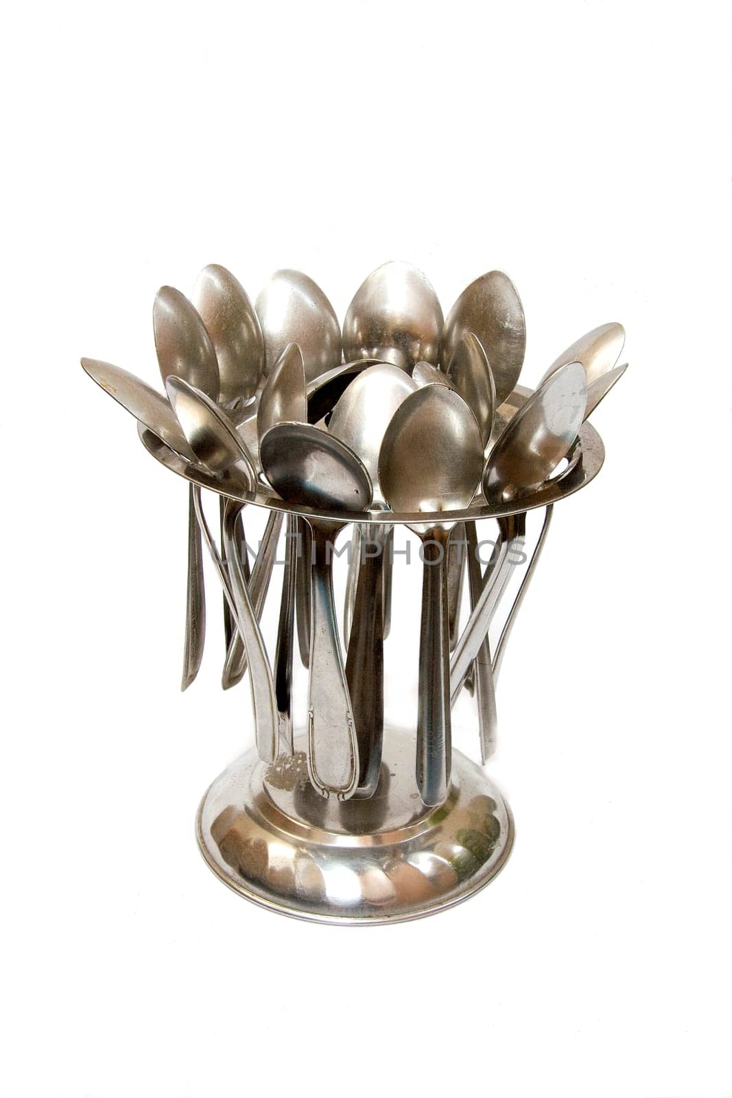 Stand holding stainless steel spoons neatly, isolate on white