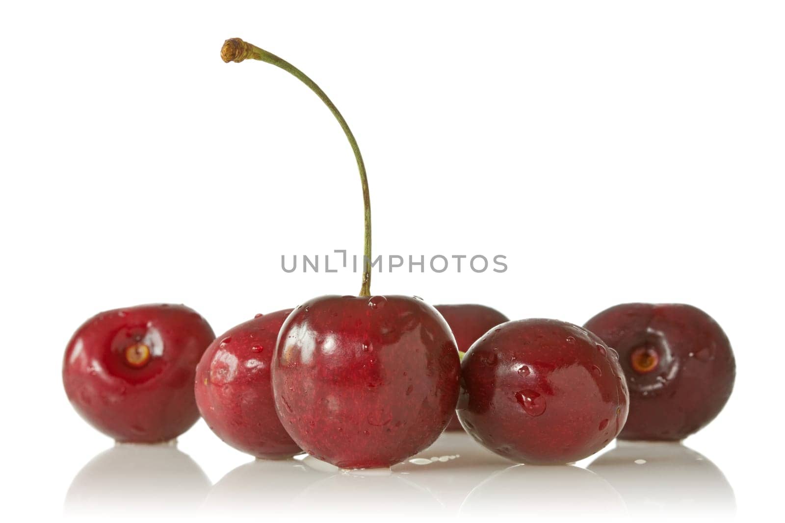 ripe juicy cherries on a white background