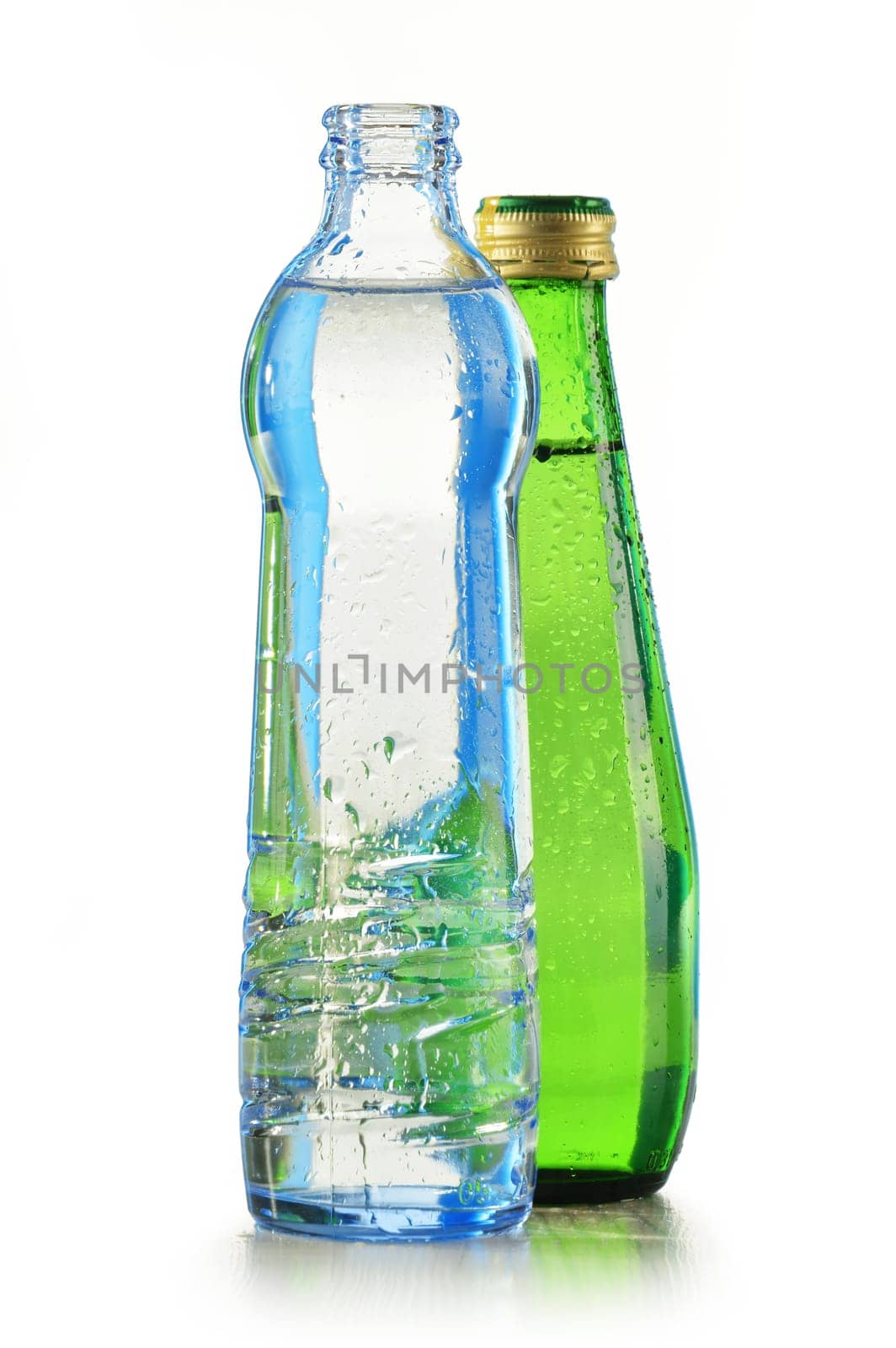Glass bottle of mineral water isolated on white