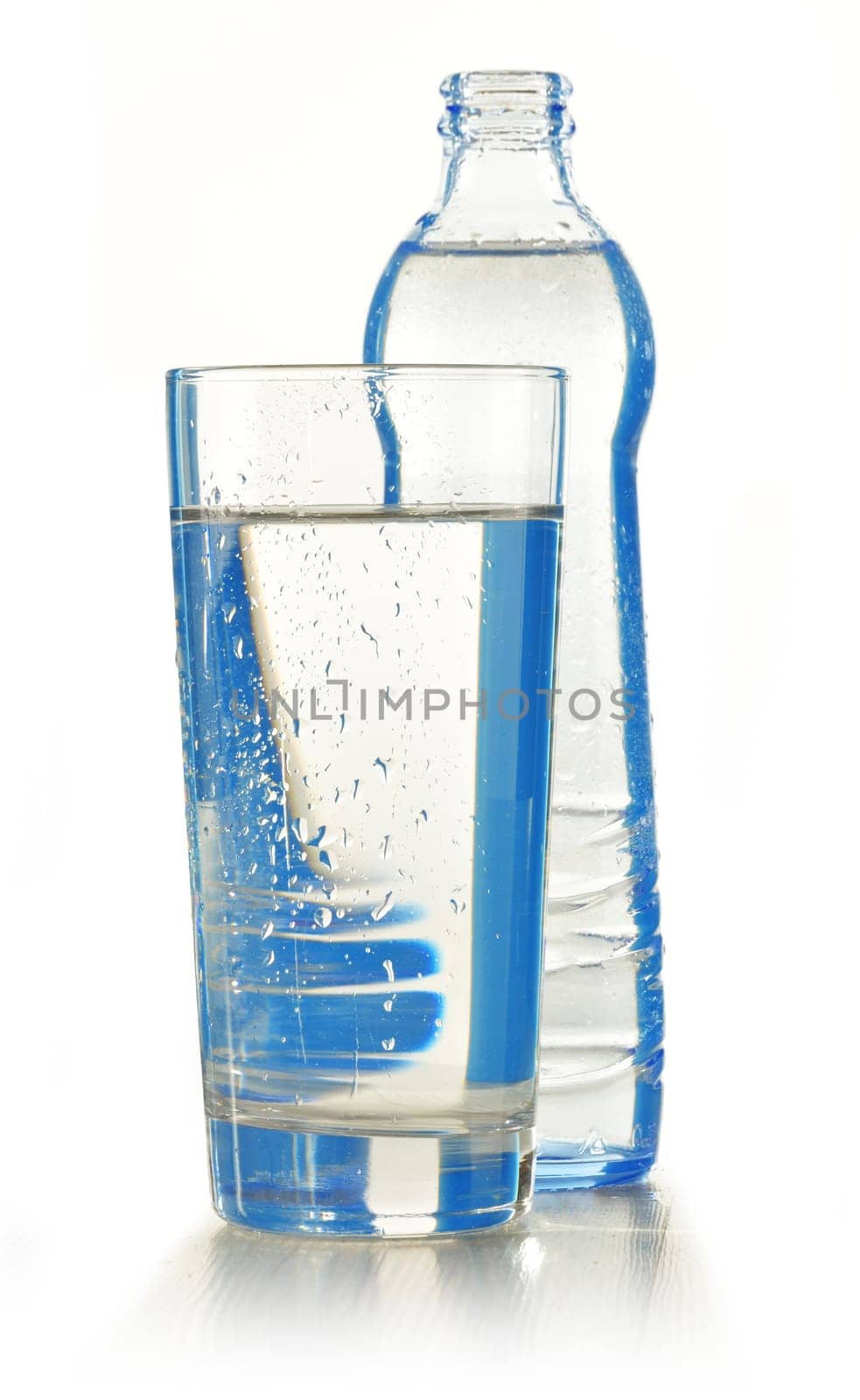 Glass bottle of mineral water isolated on white