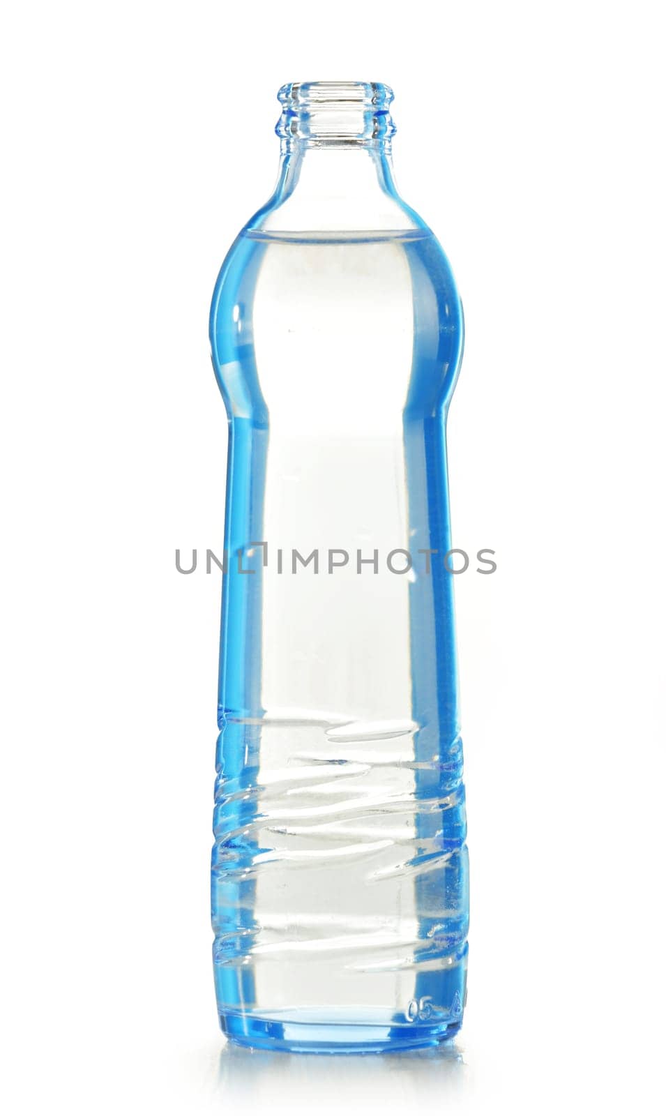 Glass bottle of mineral water isolated on white