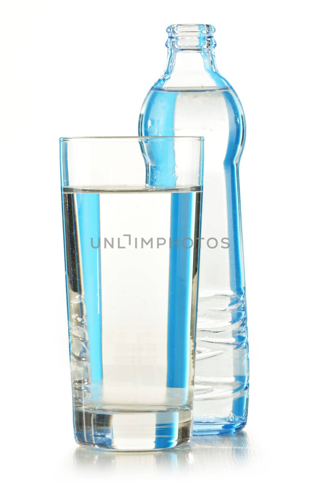Glass bottle of mineral water isolated on white