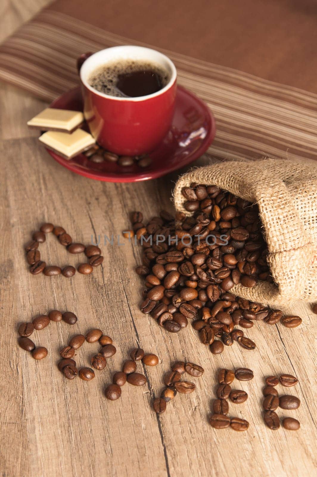Grains of coffee on a wooden surface