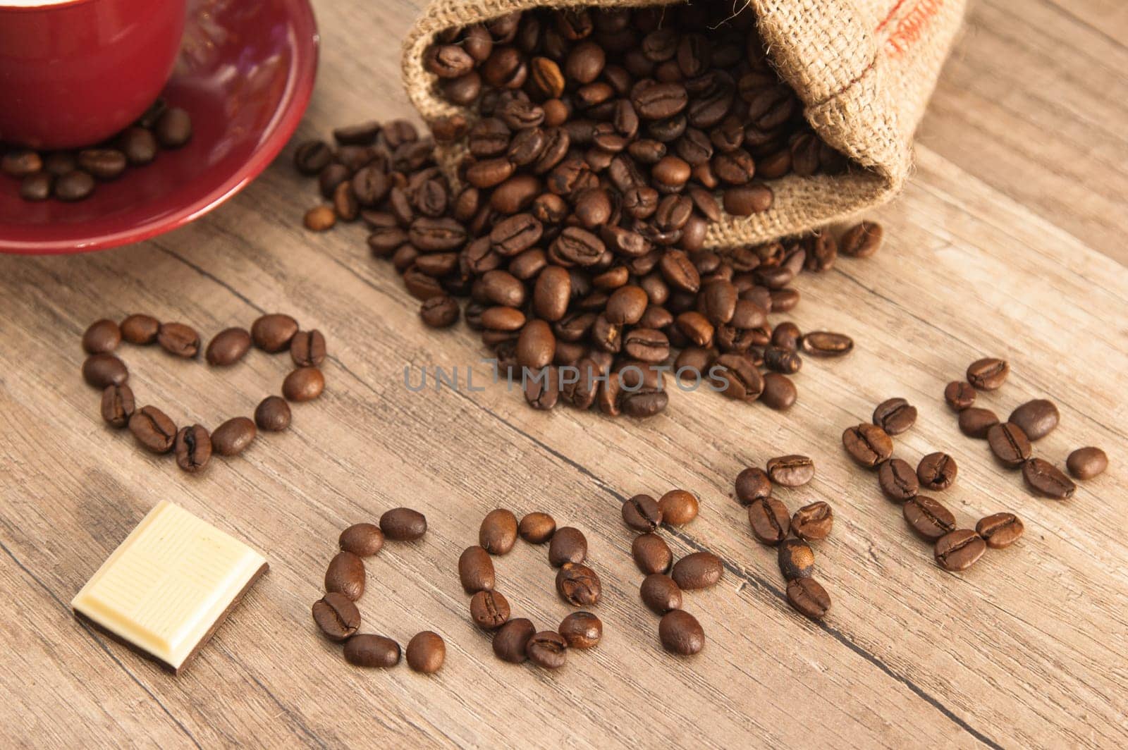 Grains of coffee on a wooden surface