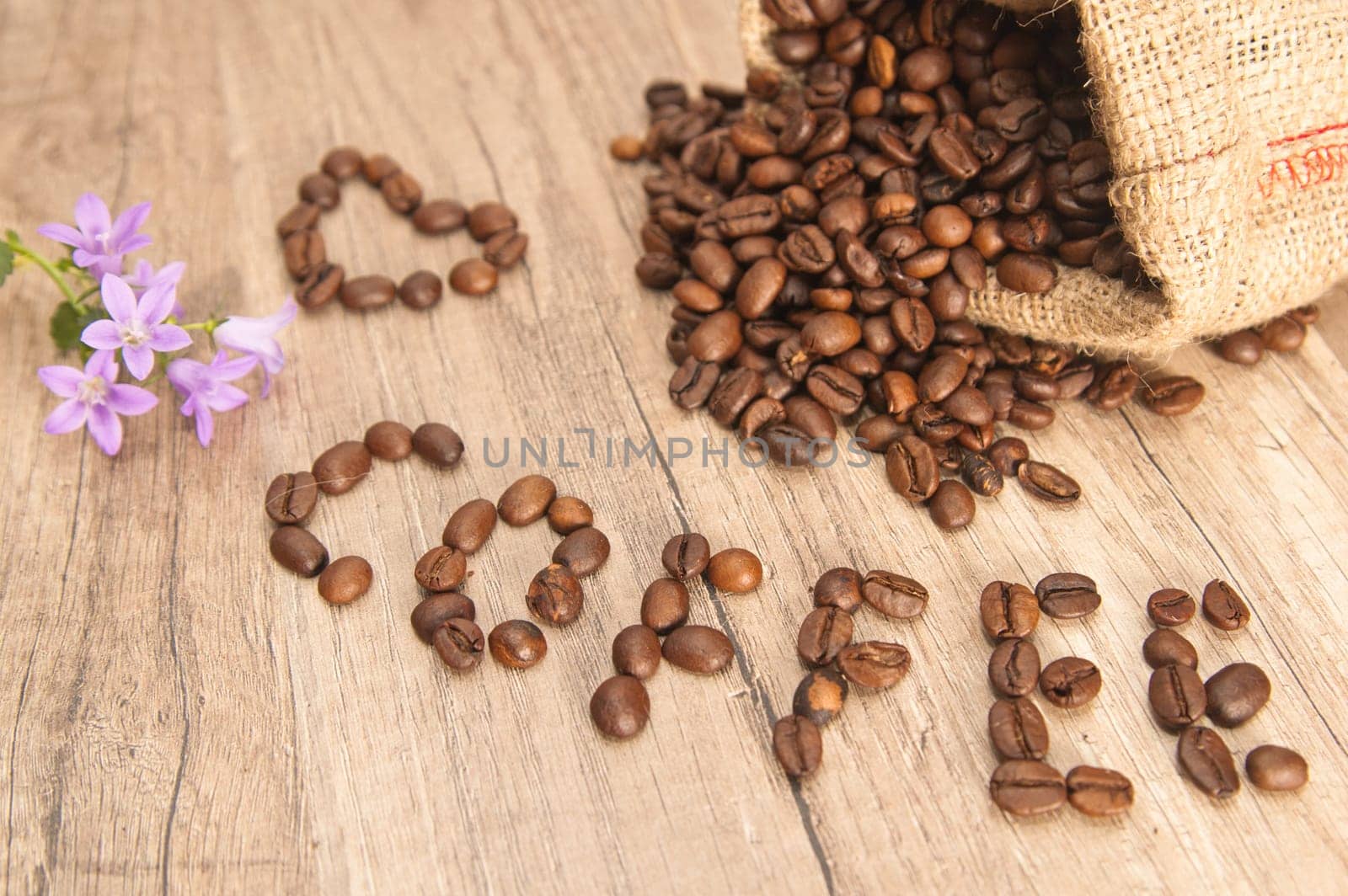 Grains of coffee on a wooden surface