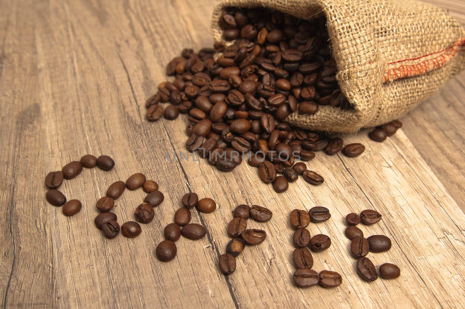 Grains of coffee on a wooden surface
