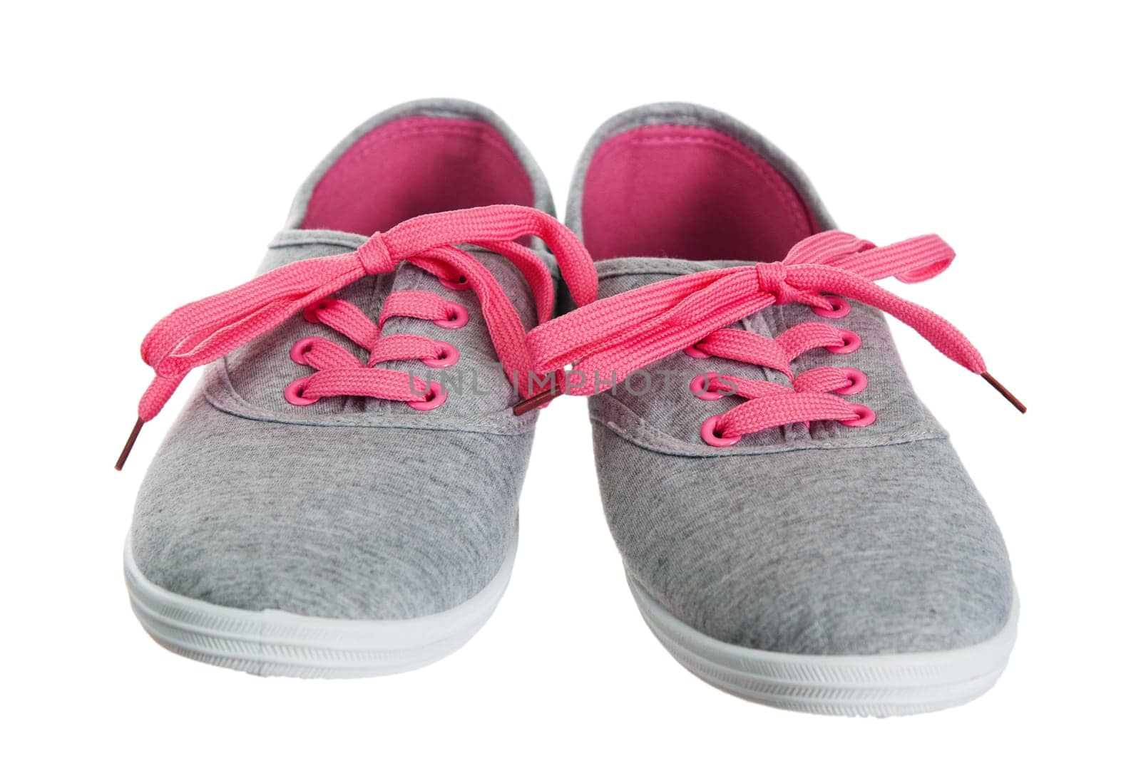 Beautiful female pink sneakers, it is isolated on white