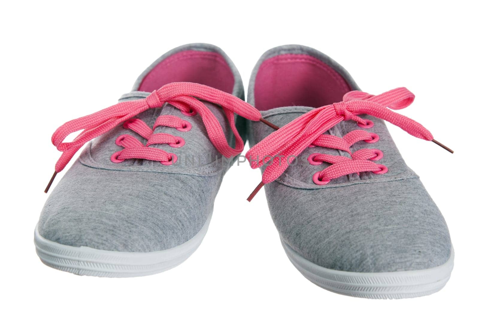 Beautiful female pink sneakers, it is isolated on white