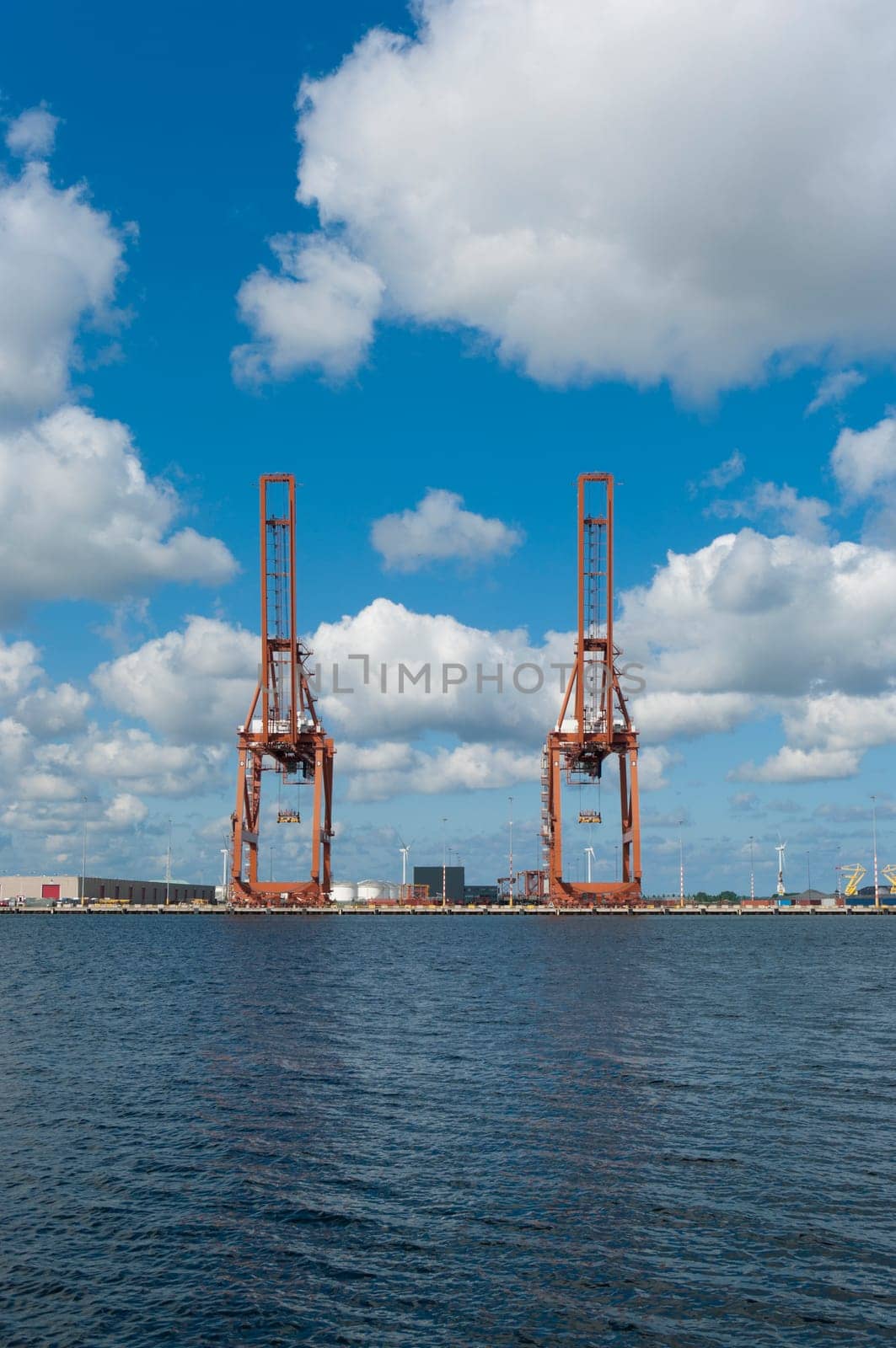 two harbor cranes in amsterdam harbor