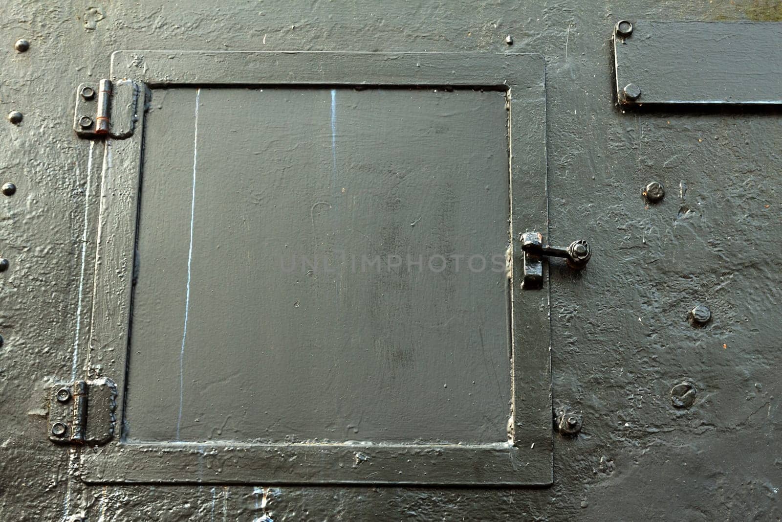 Steel hatch in a steel wall on a locomotive