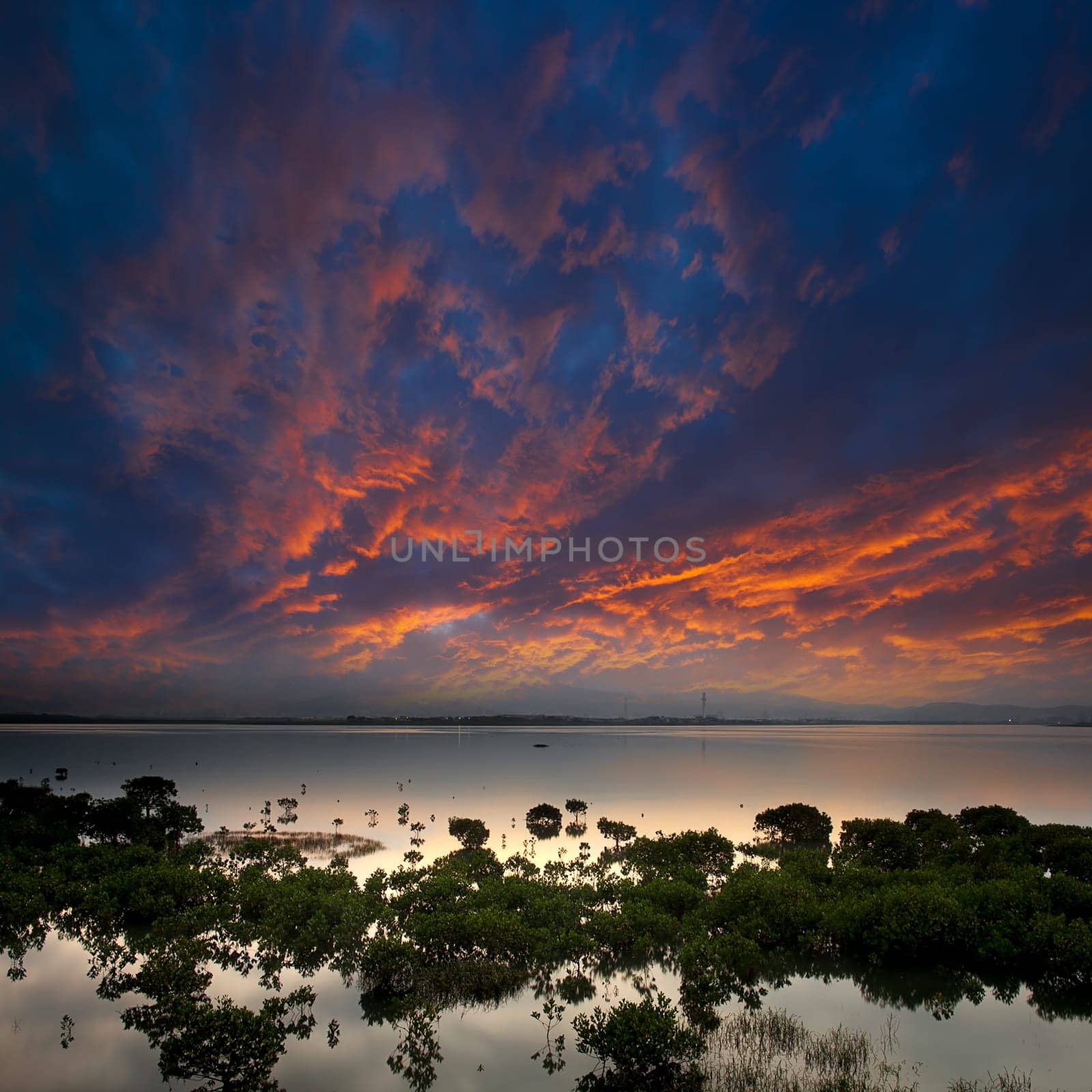 morning lake landscape with sunrise over mountains
