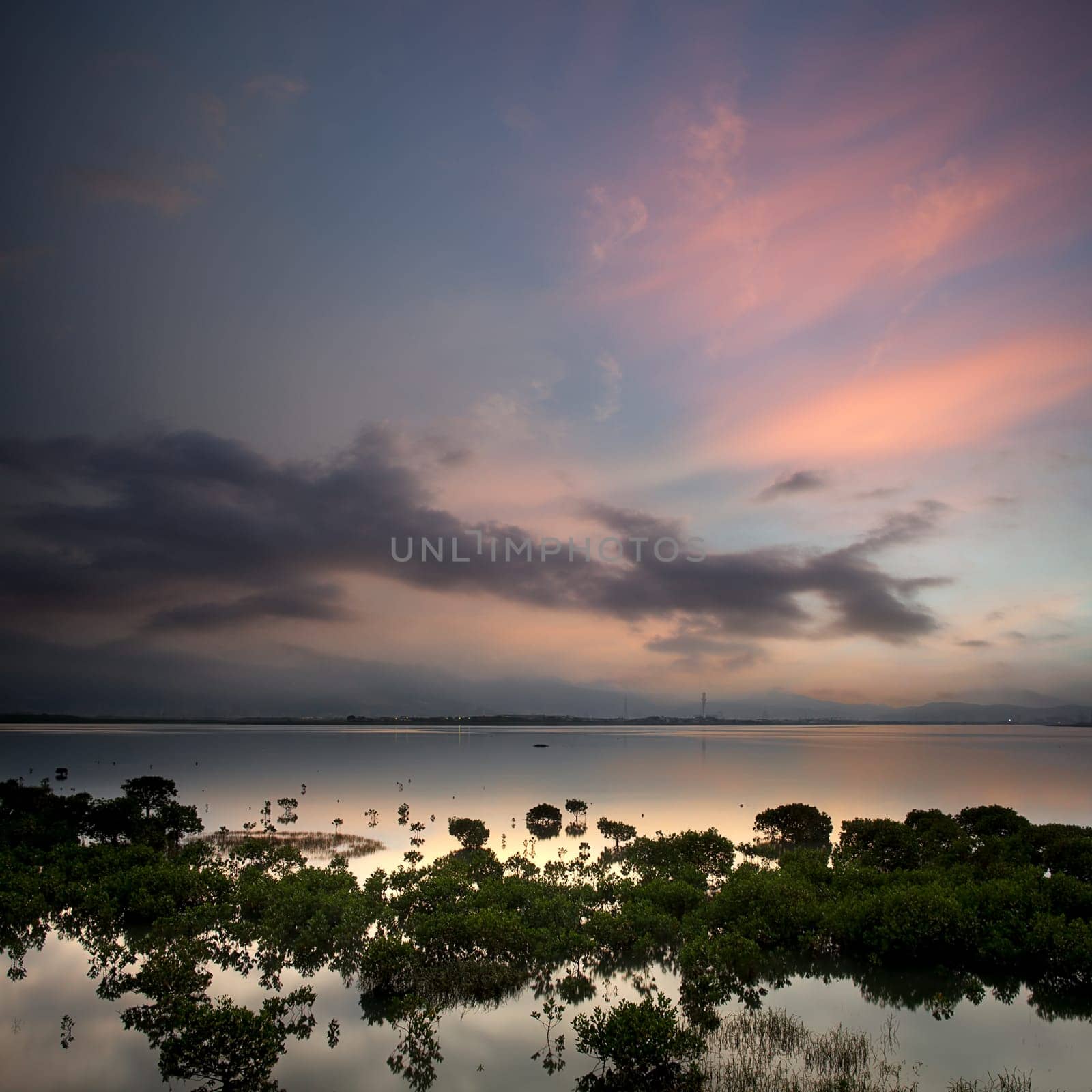morning lake landscape with sunrise over mountains