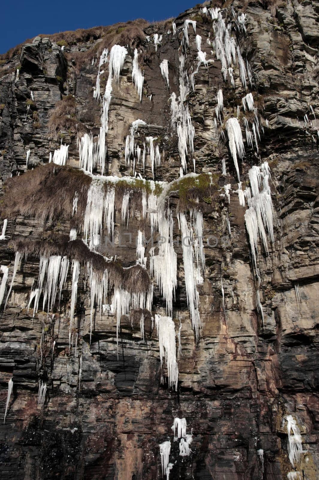 icicles on a cliff face in ballybunion ireland on a winters day