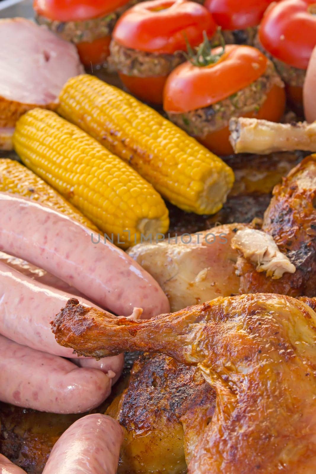 Assorted pieces of grilled vegetables, meat and chicken ready for sale at a farmer's market. (Provence, FRance)