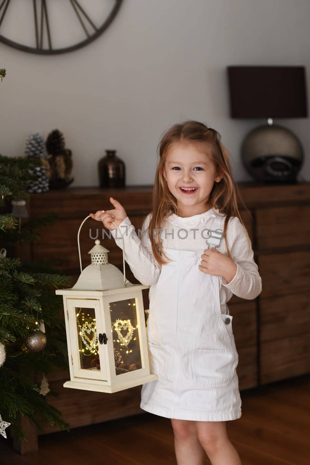 Girl holding a lantern with lights