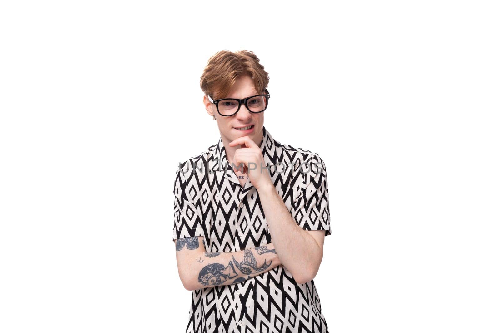 young smart red-haired caucasian man with glasses for vision in a summer short-sleeved shirt in black and white.