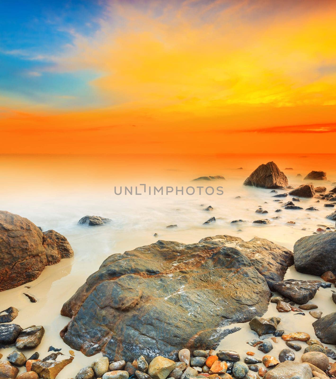 Sunrise over the sea. Stone on the foreground