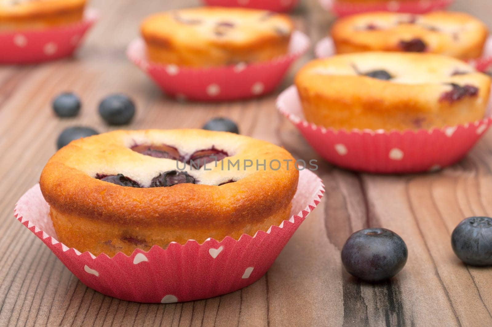 Homemade Blueberry Muffins on Wooden Table