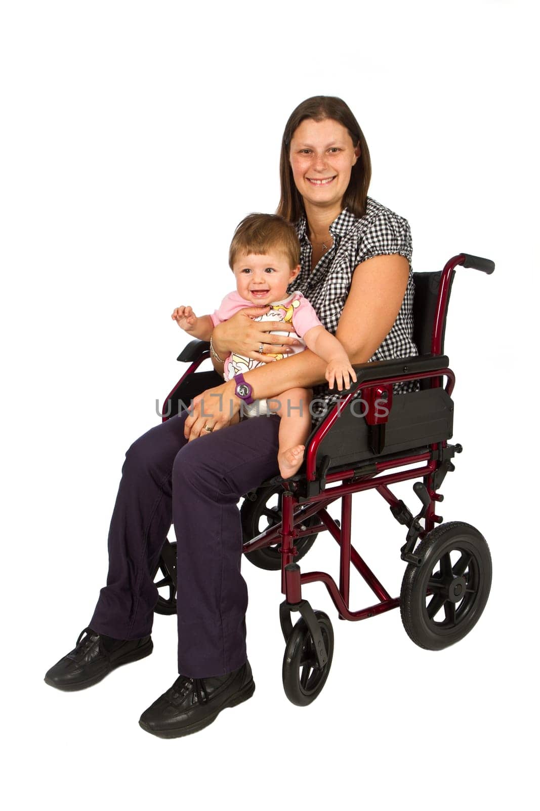 A smiling girl with a baby  in a wheelchair isolated on white background