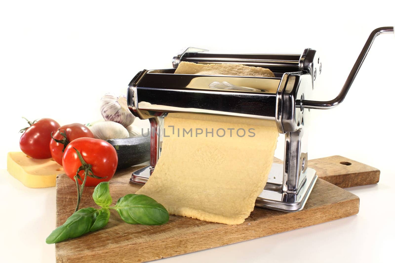 a pasta machine with homemade pasta dough
