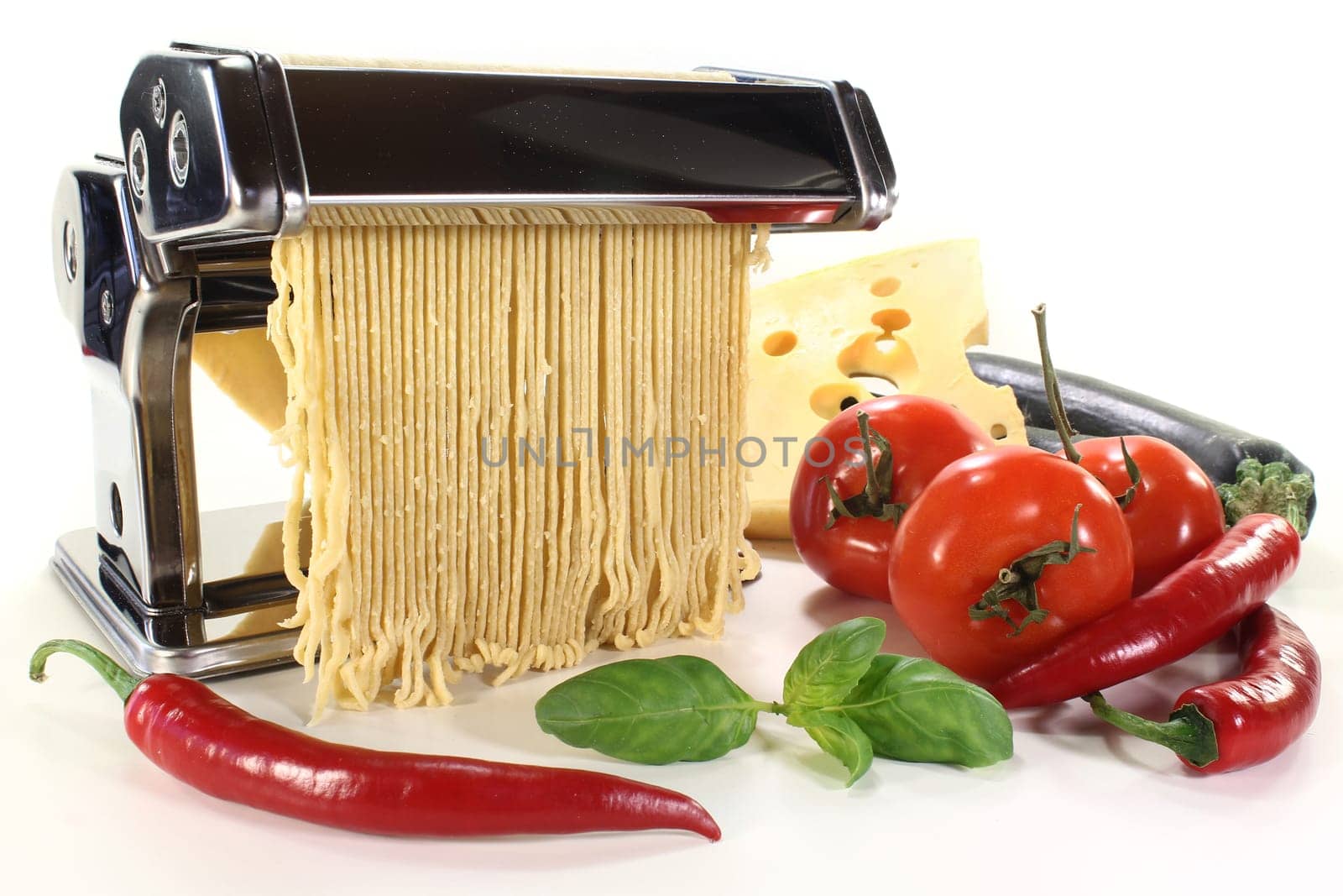 a pasta machine with homemade pasta dough