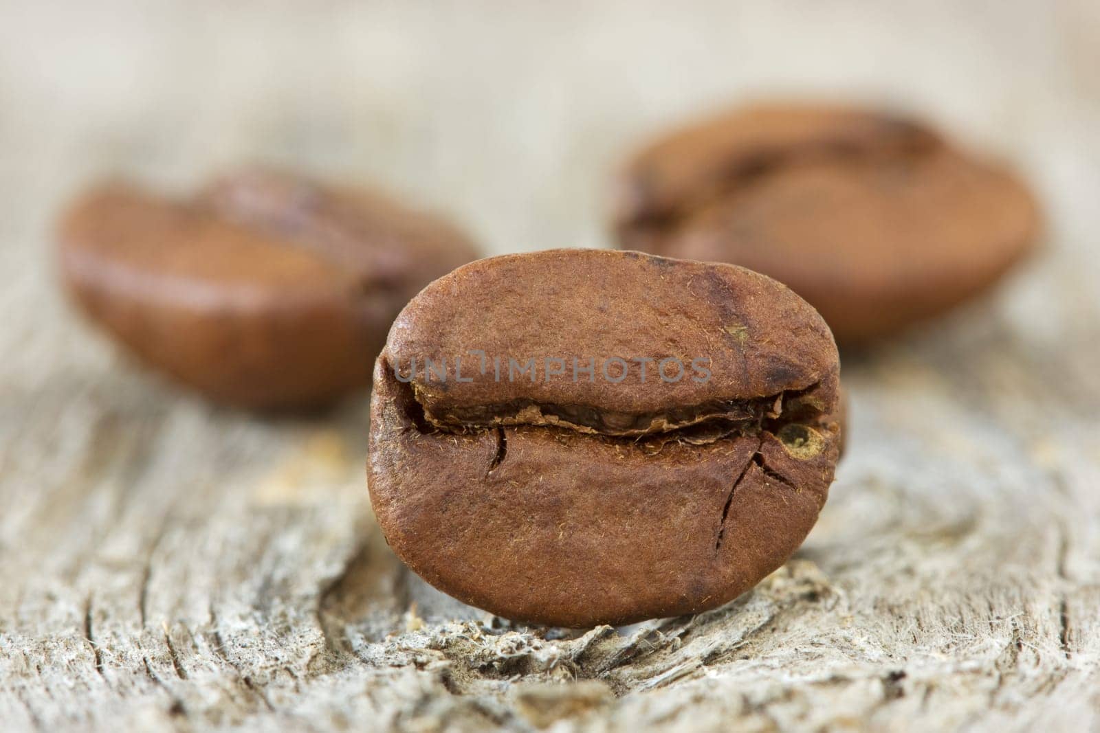 roasted coffee beans on the wooden background