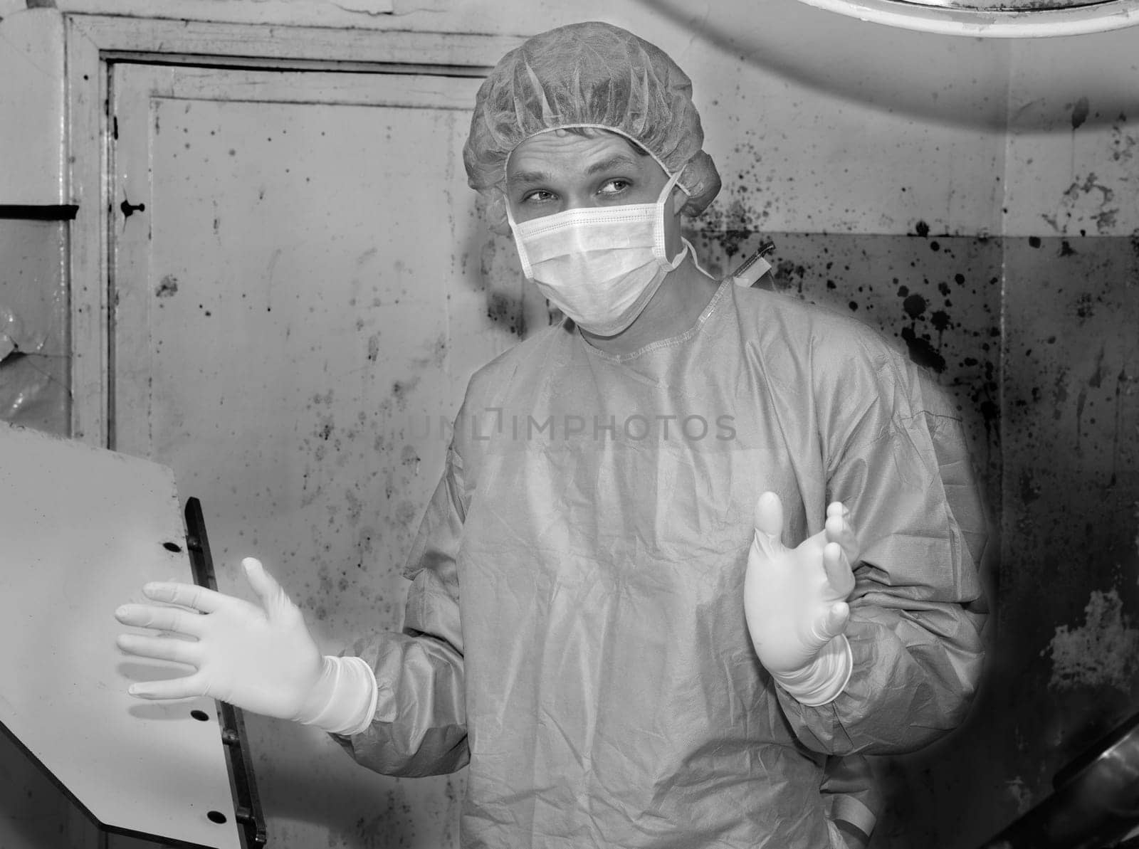 Shaded surgeon widing hands before coming difficult surgery