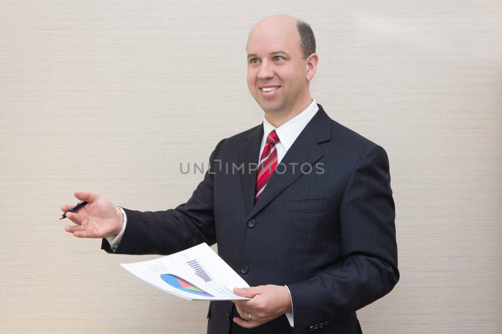 Smiling business man with document.
